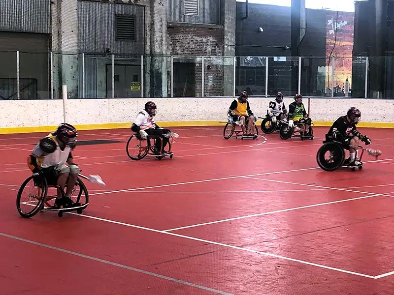 Wheelchair lacrosse team playing