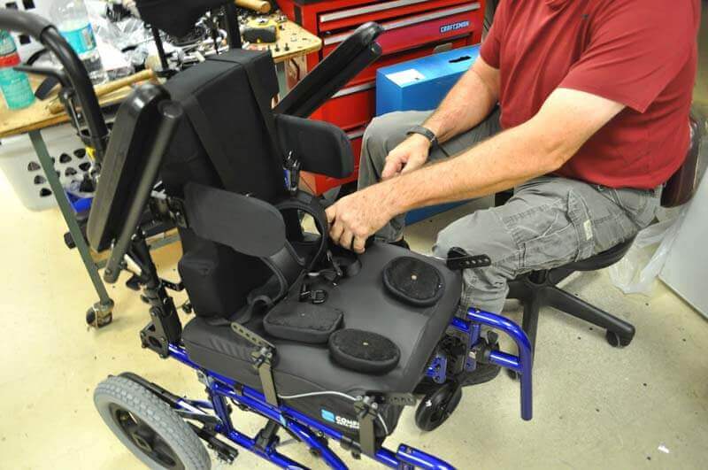 Equipment being installed on a manual wheelchair