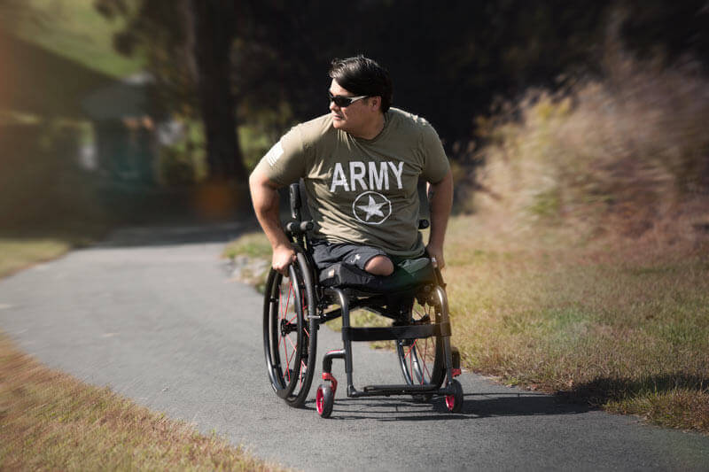A veteran with amputations using a wheelchair