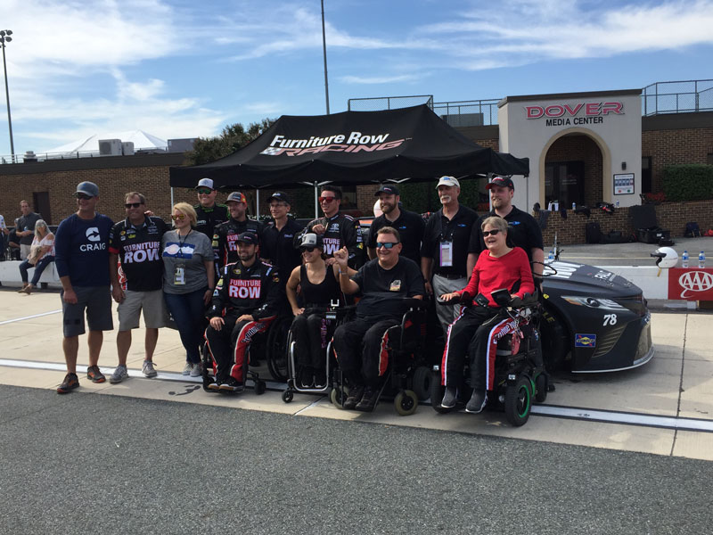 Darryl Gwynn, front row second from right, with fellow guest drivers and Furniture Row Racing team members