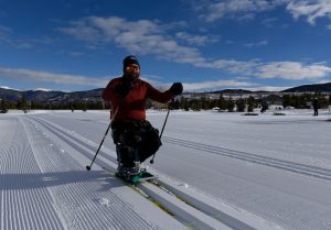 A disabled man cross-country skiing